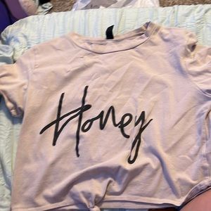 Very cute crop top in tan that says honey